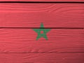 Flag of Morocco on wooden wall background. Grunge Moroccan flag texture. Royalty Free Stock Photo