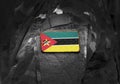 Flag of Mozambique  on military uniform. Army, troops, soldiers. Collage Royalty Free Stock Photo