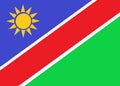 The flag of Namibia with diagonal bands of indigo blue white red green and a twelve pointed yellow star