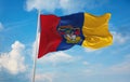 flag of Naval ensign of New Granada , Colombia at cloudy sky background on sunset, panoramic view. Colombian travel and patriot