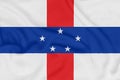 Flag of Netherlands Antilles on textured fabric. Patriotic symbol