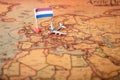 The flag of the Netherlands and the plane on the world map Royalty Free Stock Photo
