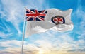 flag of New South Wales Ambulance Service , Australia at cloudy sky background on sunset, panoramic view. Australian travel and