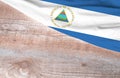 Flag Nicaragua and space for text on a wooden background