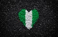 Flag of Nigeria, Nigerian flag, heart on the black background, stones, gravel and shingle, wallpaper, valentine`s day Royalty Free Stock Photo