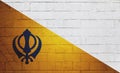 Flag of Nishan Sahib painted on a wall