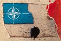 Flag of the North Atlantic Treaty Organization NATO on an abstract background of torn textured paper with watercolor stains