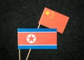 The flag of North Korea and China made from paper. Royalty Free Stock Photo