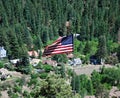 Flag over the Historical Miners Town of Ouray in the San Juan Mountains, Colorado