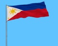 Flag of Philippines in peacetime on the flagpole fluttering in the wind on pure blue background