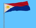 Flag of Philippines in wartime on the flagpole fluttering in the wind on a pure blue background