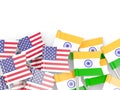 Flag pins of USA and India on white