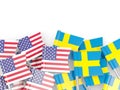 Flag pins of USA and Sweden on white