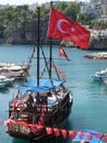 Flag pirate ship sea water harbour beach bar resturant old town Antalya turkey