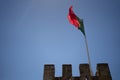 Flag of portugal and a clear blue sky behind Royalty Free Stock Photo