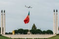 Flag of Portugal at Eduardo VII Park juxtaposition against an aircraft belonging to Air