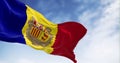 The flag of the Principality of Andorra waving in the wind on a clear day