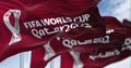 Flag with the Qatar 2022 Fifa World Cup logo flapping in the wind