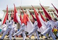 The flag-raising troops carried the red and white flag, the Indonesian state flag, in a parade in Bandung, East Java