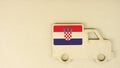 Flag of Croatia on the recycled cardboad truck icon, national sustainable logistics concept