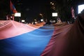 The flag of the Republic of Armenia in the hands of the protesters