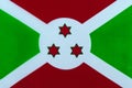 Flag of the Republic of Burundi on a textile basis close-up Royalty Free Stock Photo