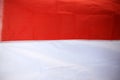 The flag of the Republic of Indonesia is red which means brave and white which means holy