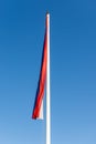 Flag of the Republic of Serbia against clear blue sky Royalty Free Stock Photo