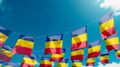 Flag of Romania against the sky, flags hanging vertically Royalty Free Stock Photo