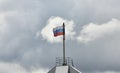 Flag of Russia against cloudy sky background Royalty Free Stock Photo