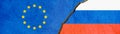 Flag of Russia and the European Union on cracked plaster as a concept of division and confrontation