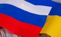 Flag of Russia and Ukraine on a destroyed wall close-up. Conflict of countries and the threat of war Royalty Free Stock Photo