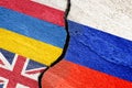 Flag of Russia and Ukraine, Poland, Great Britain on a cracked stucco wall as a concept of conflict and support Royalty Free Stock Photo