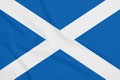 Flag of Scotland on soft and smooth silk texture. National symbol of Scotland