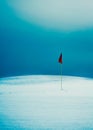 Flag on snowy golf course Royalty Free Stock Photo