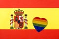 The flag of Spain and the heart in the form of the LGBT flag. The sign of a woman