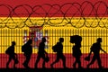 Flag of Spain - Refugees near barbed wire fence. Migrants migrates to other countries.