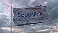Flag with the Sputnik V vaccine logo waving in the wind. Sputnik V is the Russian COVID-19 vaccine