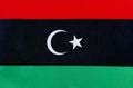 Flag of the state of Libya on a textile basis close up Royalty Free Stock Photo