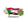 Flag sudan character in cartoon shape holding gift