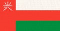 Flag of Sultanate of Oman. Oman flag on fabric surface. Asian country