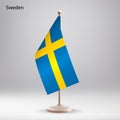 Flag of Sweden hanging on a flag stand. Royalty Free Stock Photo