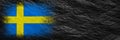 Flag of Sweden. Flag is painted on black crumpled paper. Paper background. Copy space. Textured background Royalty Free Stock Photo