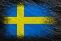 Flag of Sweden. Flag is painted on black crumpled paper. Paper background. Copy space. Textured background Royalty Free Stock Photo