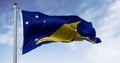 Flag of Tokelau waving in the wind on a clear day