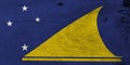 Flag of Tokelau on wooden plate background. Grunge Tokelau flag texture.