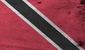 Flag of Trinidad and Tobago on wooden plate background. Grunge Trinidadian flag texture.