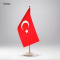 Flag of Turkey hanging on a flag stand.