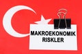 On the flag of Turkey lies a business card with the inscription - macroeconomic risks