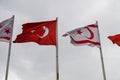 flag of Turkey and Northern Cyprus against the background of a cloudy sky in winter 3 Royalty Free Stock Photo